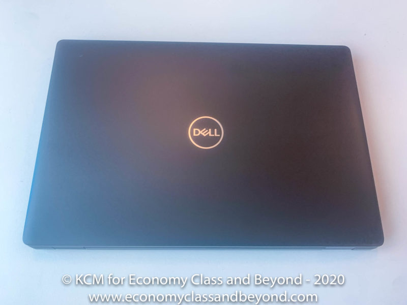 a black laptop on a white surface