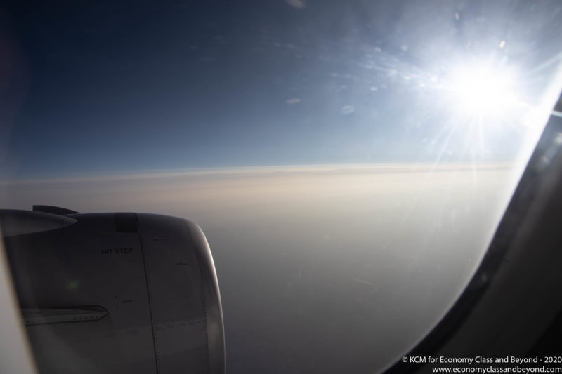 a view of the sun from an airplane window