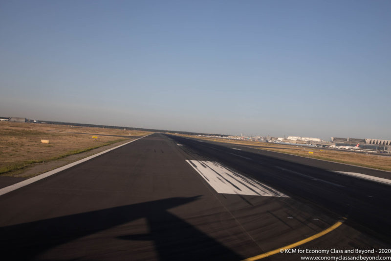 a runway with a plane wing on it