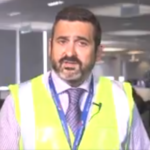 a man wearing a yellow vest