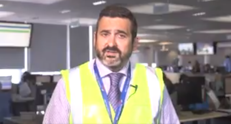 a man wearing a yellow vest
