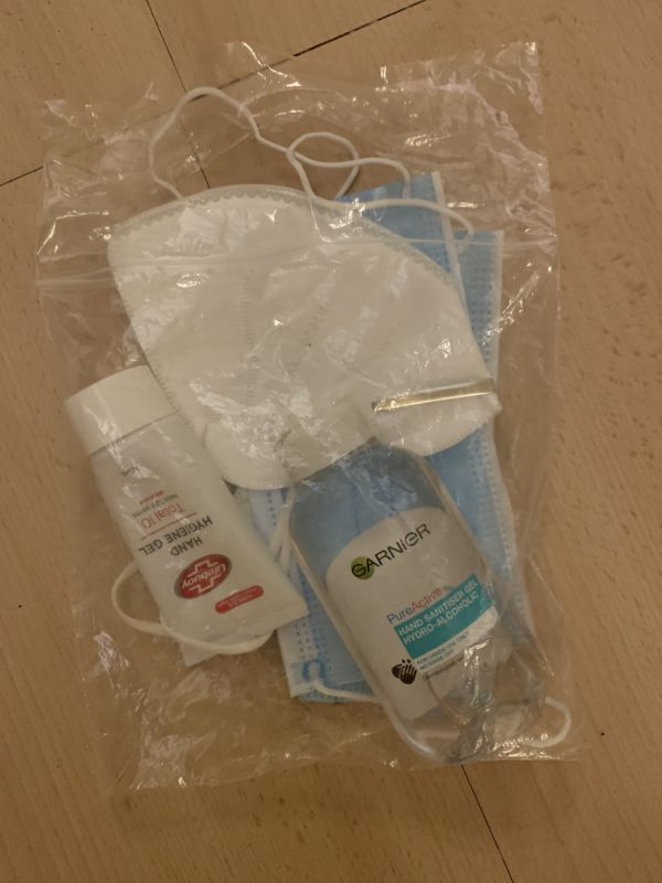 a bag of face masks and hand sanitizers