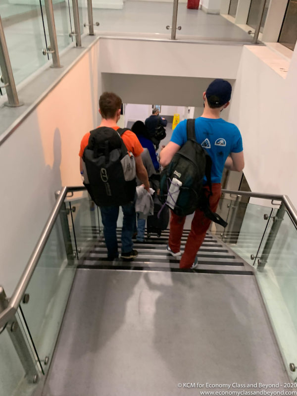 a group of people walking up stairs
