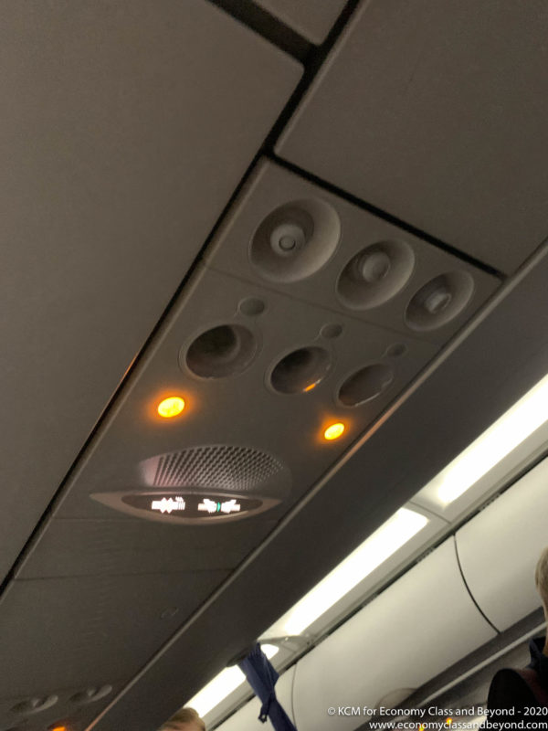a ceiling with lights and speakers