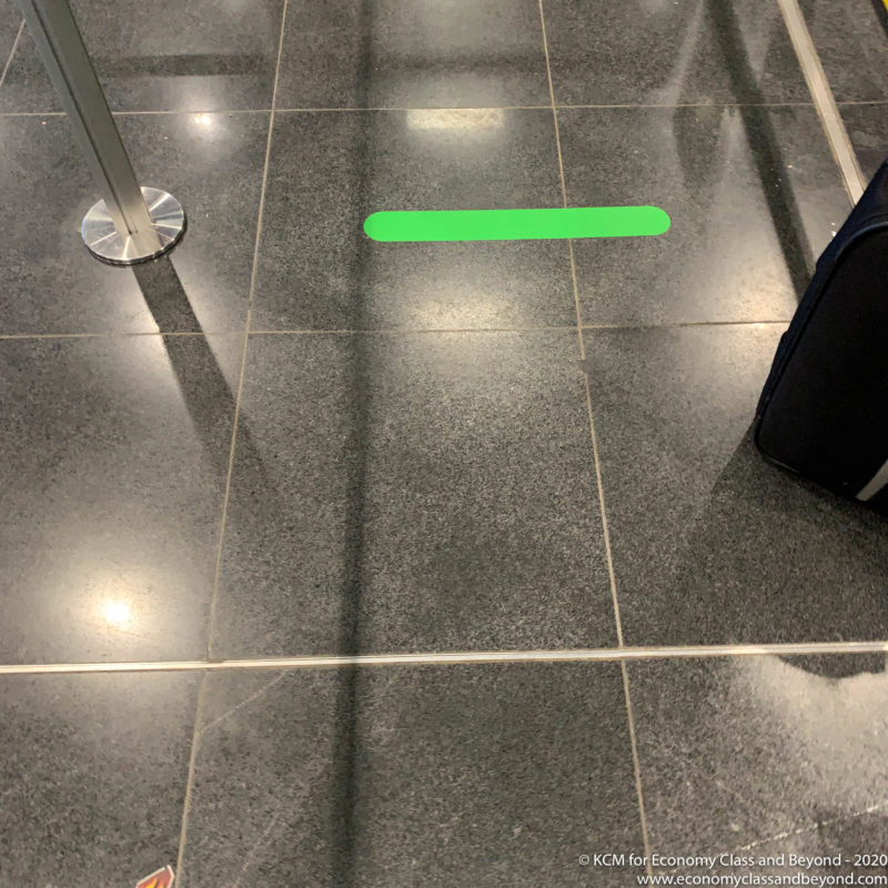 a green line on a tile floor