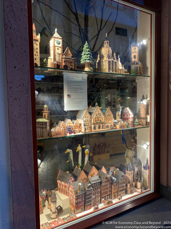 a display case with a group of buildings and trees