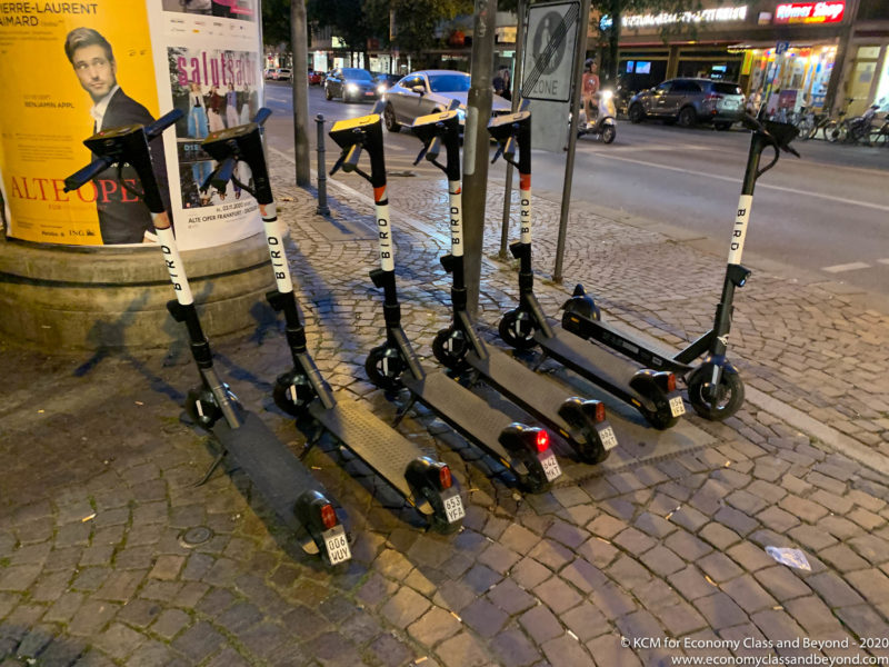 a group of scooters on a sidewalk