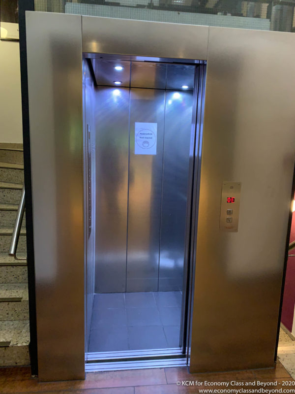 an elevator with a sign on the door