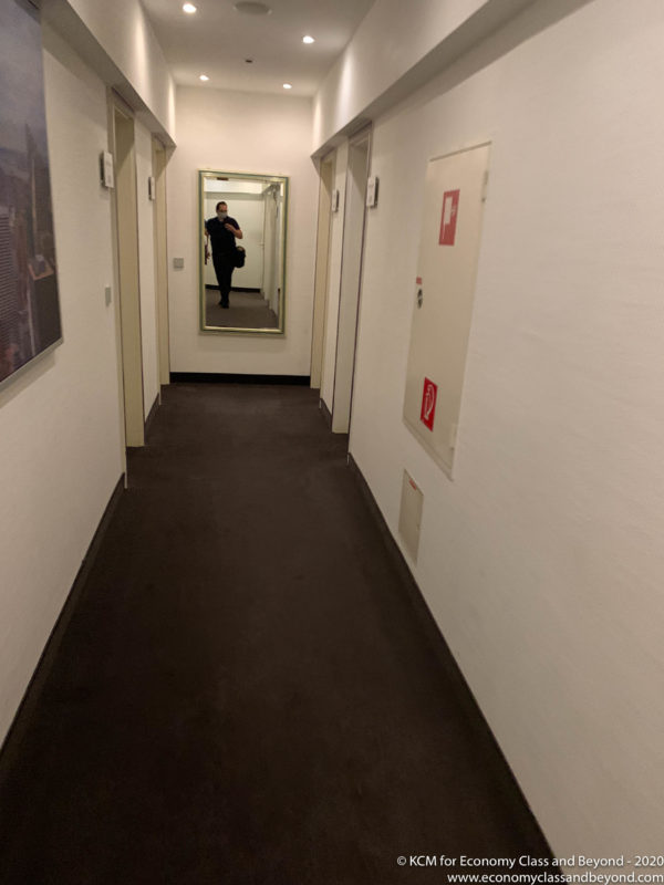 a person standing in a hallway