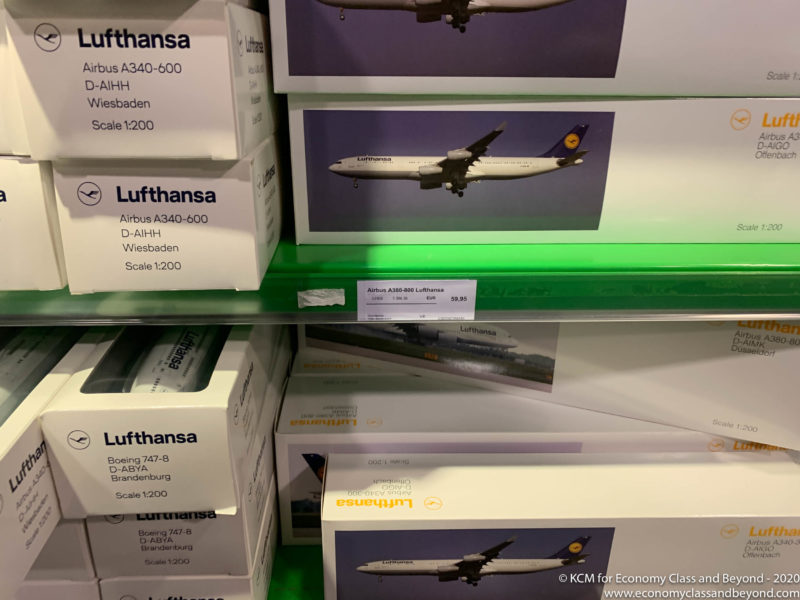a shelf with boxes and a picture of an airplane