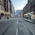 a street with buildings and tram tracks