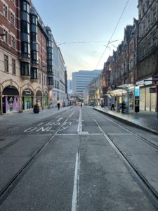 a street with buildings and tram tracks