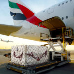 a plane loading cargo onto a truck