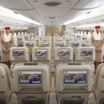 a group of people standing in an airplane