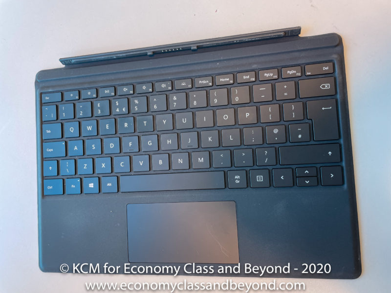 a black keyboard with a touch pad