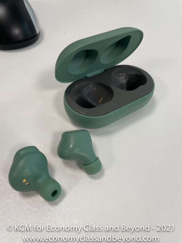 a green earbuds with a case