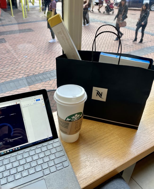 a laptop and coffee bag on a table