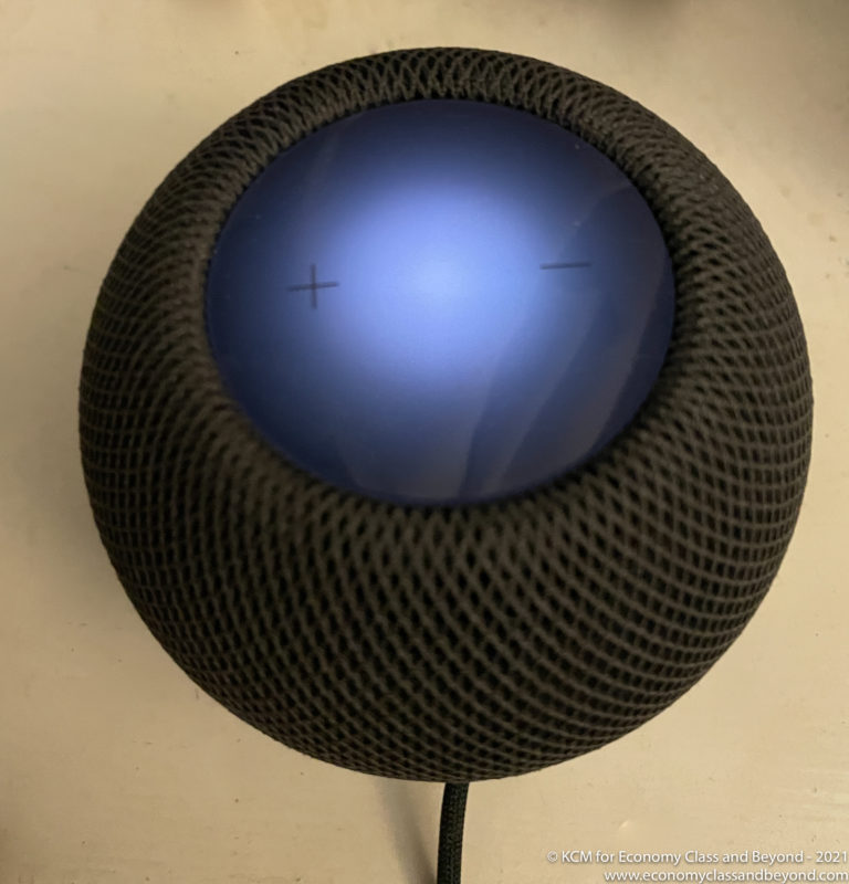 a blue and black round object with a wire