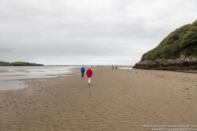 people walking on a beach
