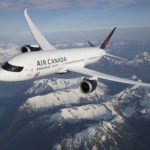 a plane flying over mountains