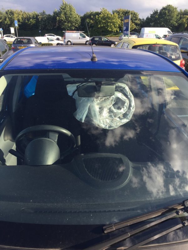 a car with a plastic bag in the windshield