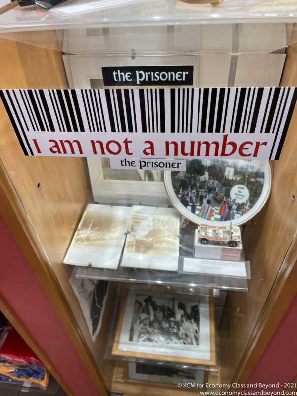 a display case with a sign and a picture on it