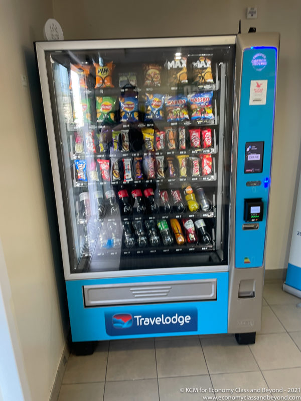 a vending machine with drinks and snacks