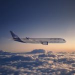 a plane flying above the clouds