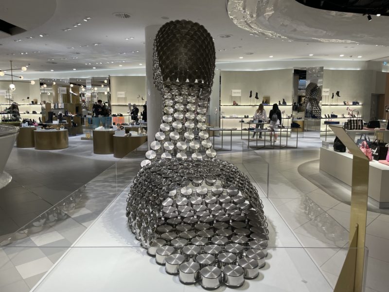 a large sculpture of pots and pans in a store