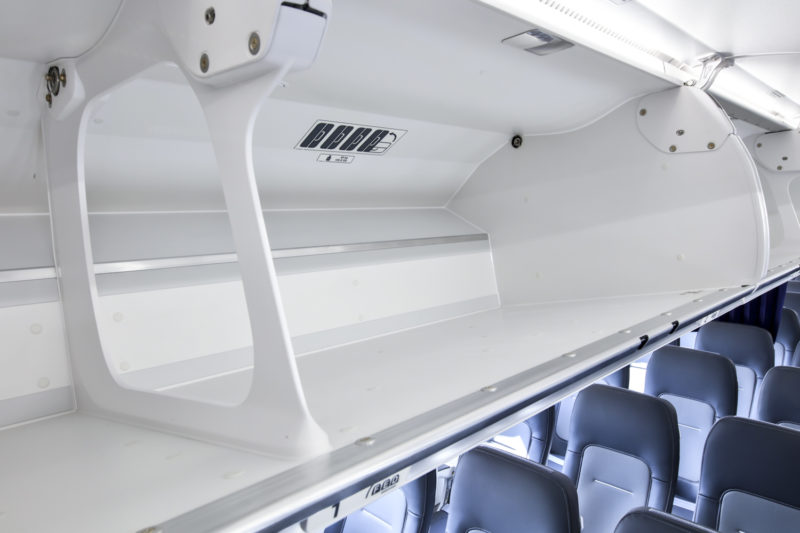 an airplane with seats and a shelf