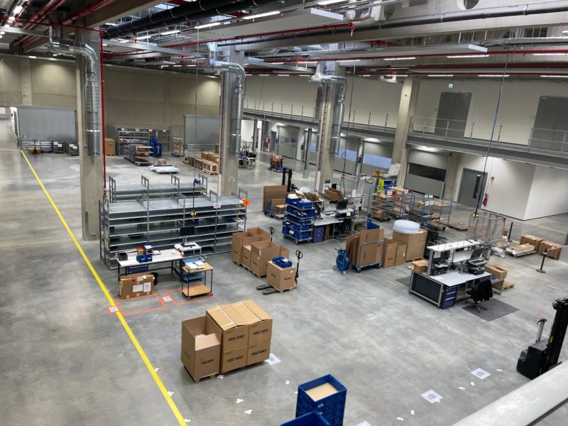 a large warehouse with boxes and shelves