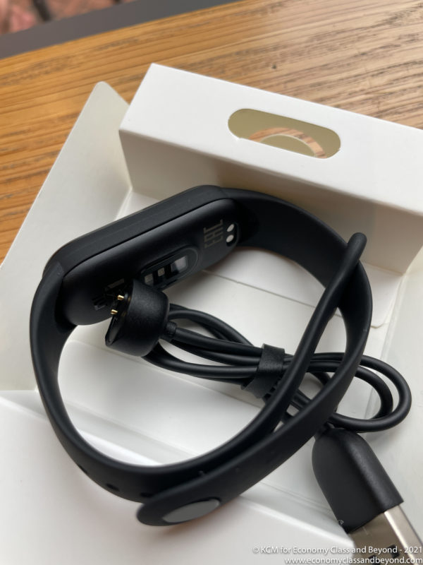 a black bracelet with a cable in a box