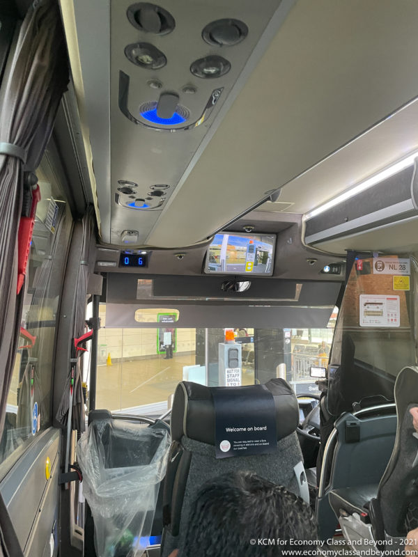 a bus with a screen and a mirror