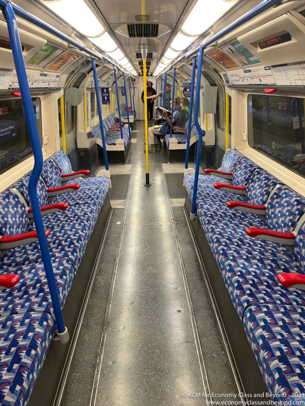 a blue and red seats on a train