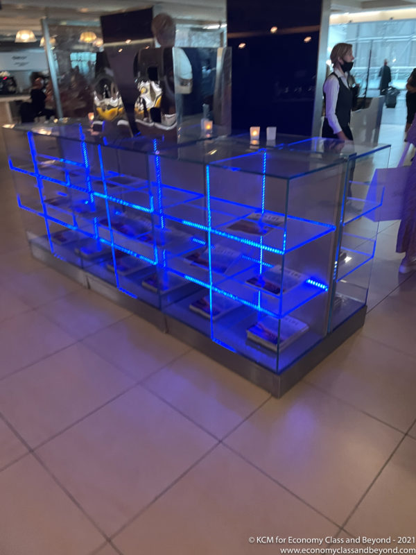 a glass display case with blue lights