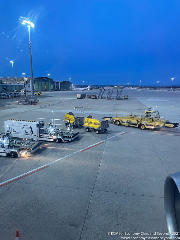 a group of vehicles parked on a tarmac