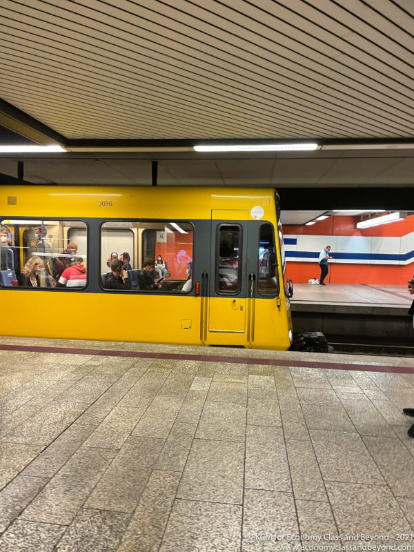 a yellow train at a train station