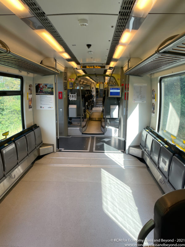 inside a train with seats and a window