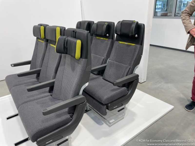 a row of grey and black seats