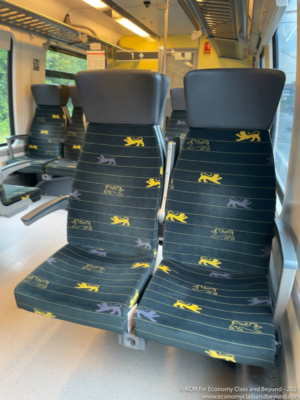 seats in a train with lions on it