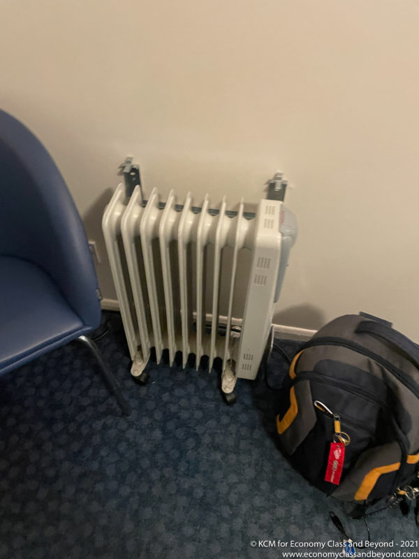 a radiator next to a backpack