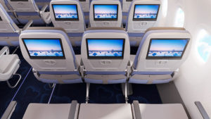a row of seats with monitors on them