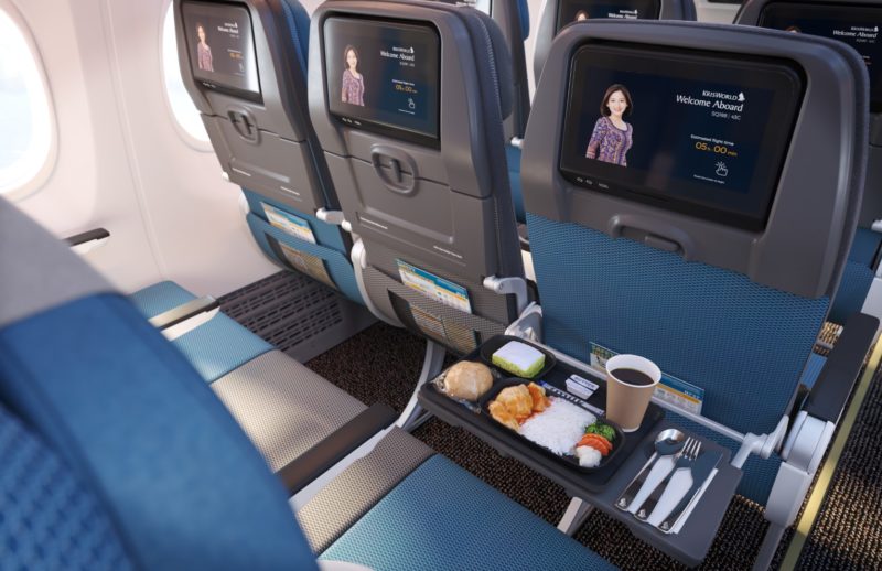 a tray of food on the seats of an airplane