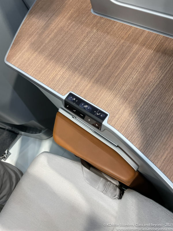 a seat with a speaker on the side
