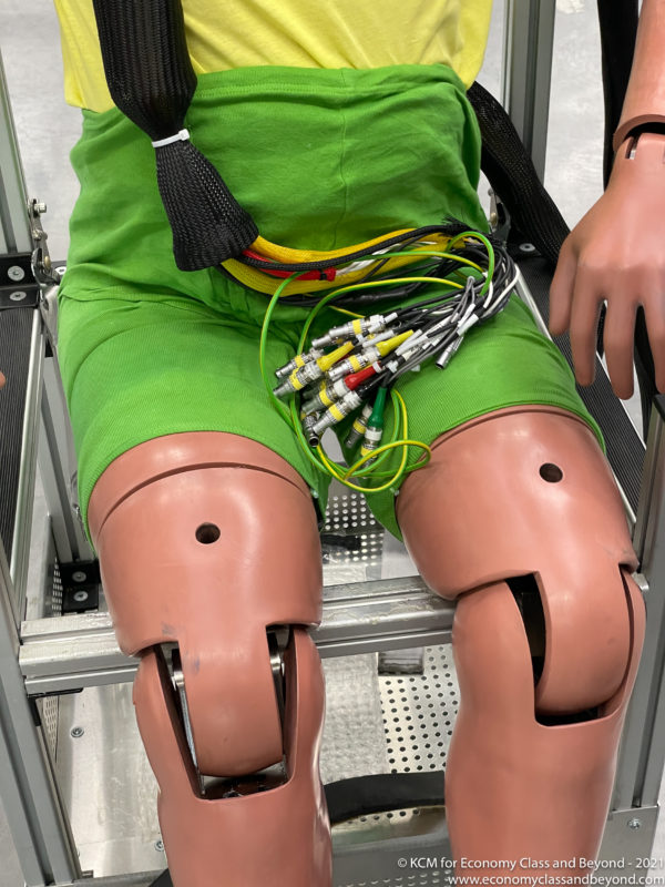 a mannequin with wires on his legs