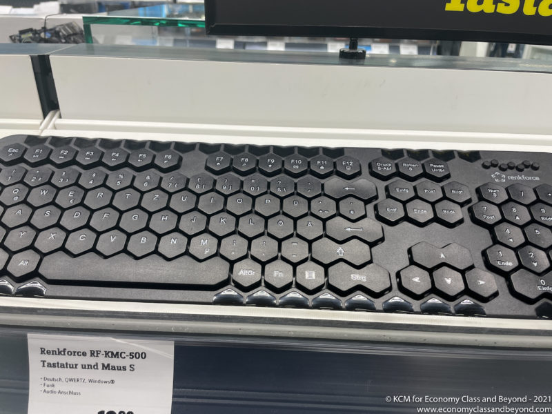 a black keyboard on a shelf