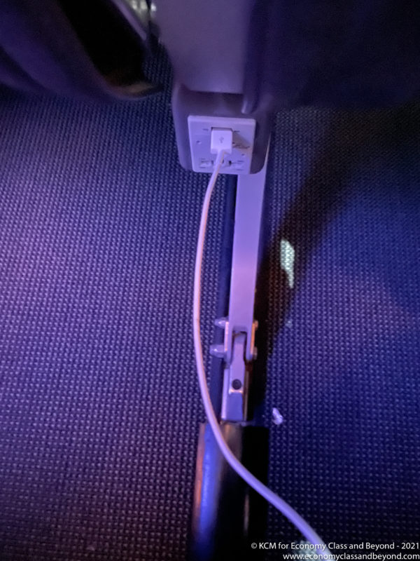 a white cord plugged into a black object