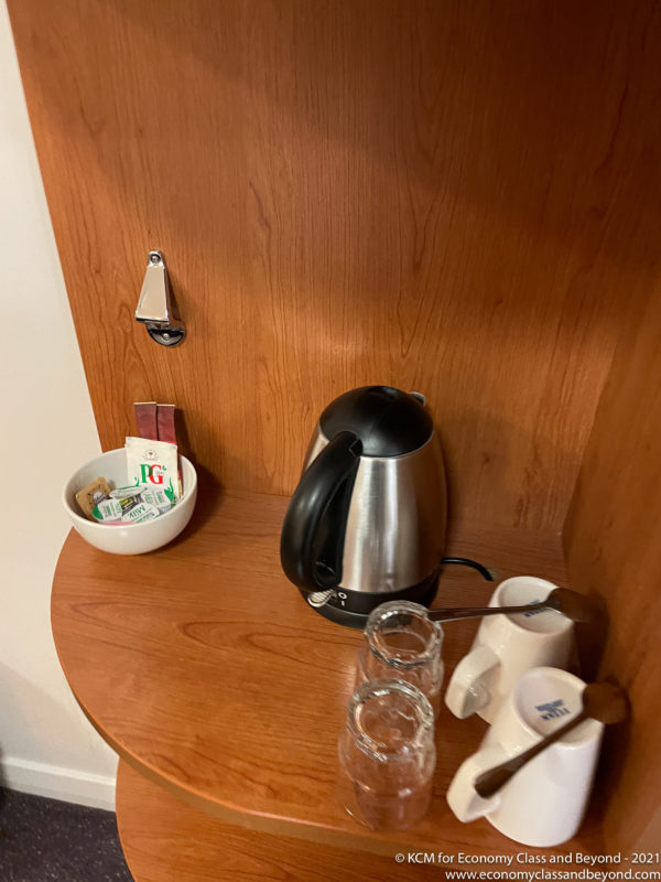 a coffee pot and cups on a table