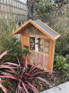a insect house in a garden