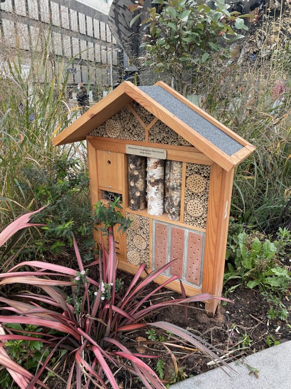 a insect house in a garden